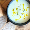 creamy cauliflower soup drizzled with cumin infused canola oil 